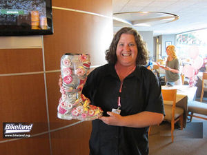 Breast cancer survivor  and pink event spokesperson Shasta Johnson shows off an Ashley Fiolek raffle boot.